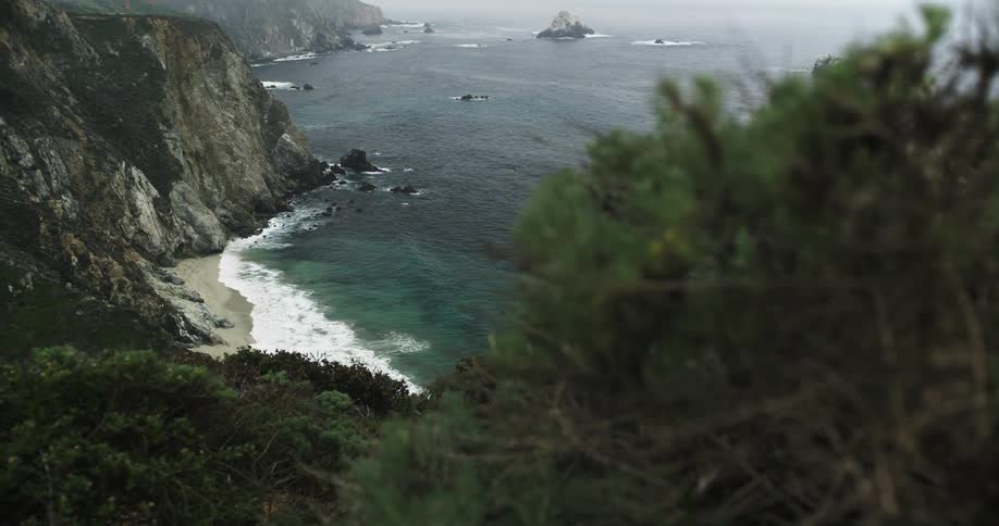 Ocean waves crash in the coastal cliffs