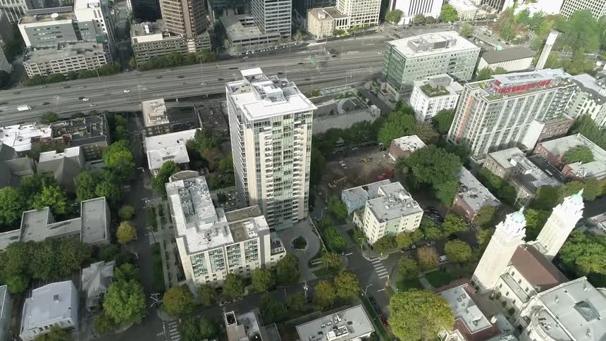 The tall buildings and freeway of city during the day