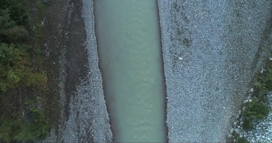 An aerial view of a river is displayed