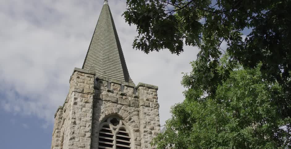 A steeple on the top of a church