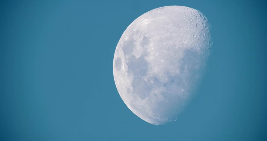 Half moon in the blue sky