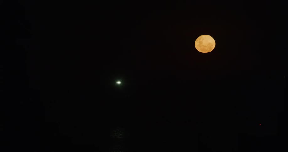 Orange full moon with dark sky