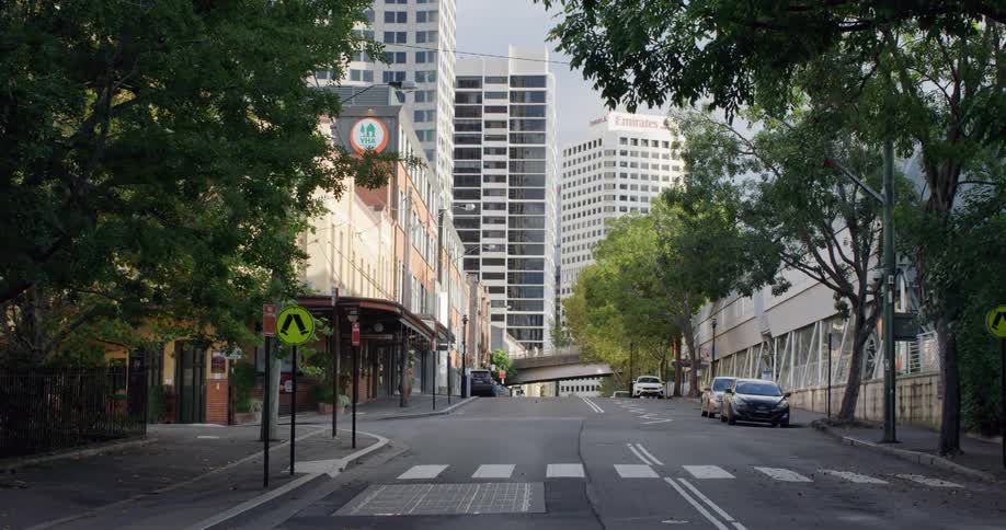 A quiet tree lined road leads to downtown