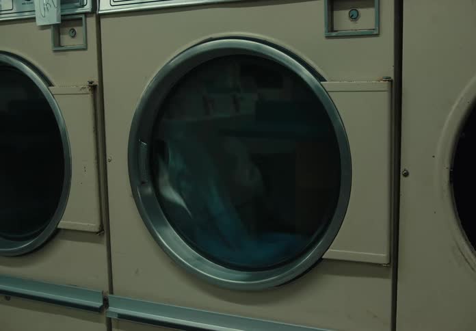 Clothes are rolling in the dryer