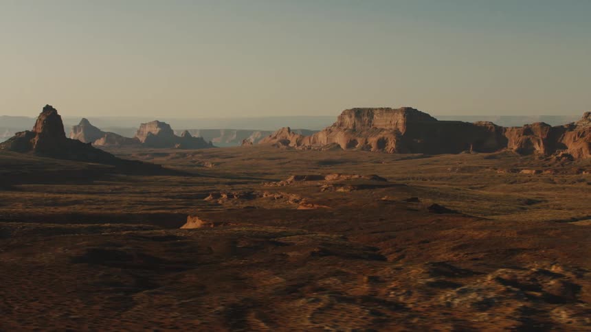 Aerial view of mesas in the badlands desert at sunset