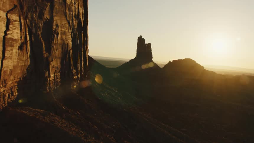 The sun is rising past the mountains