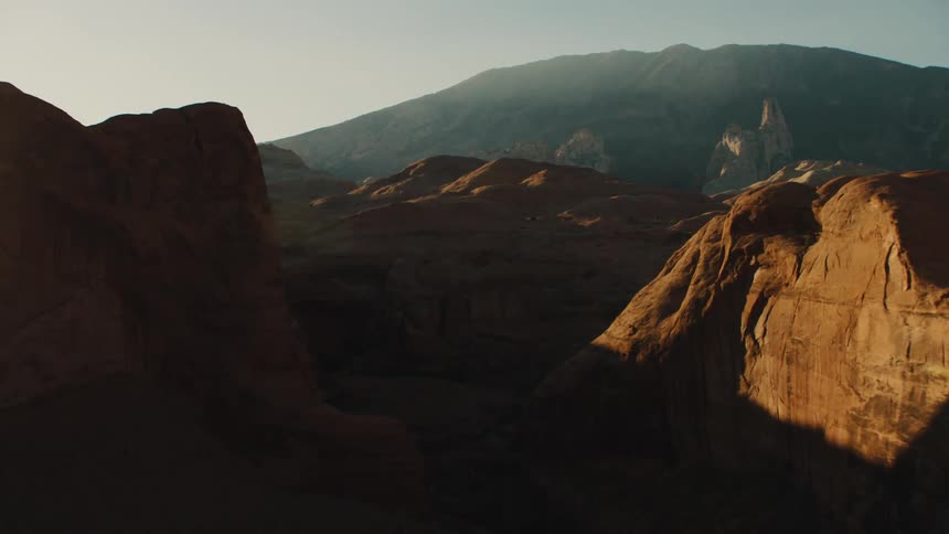 The cliffs of the canyon give off dark shadows