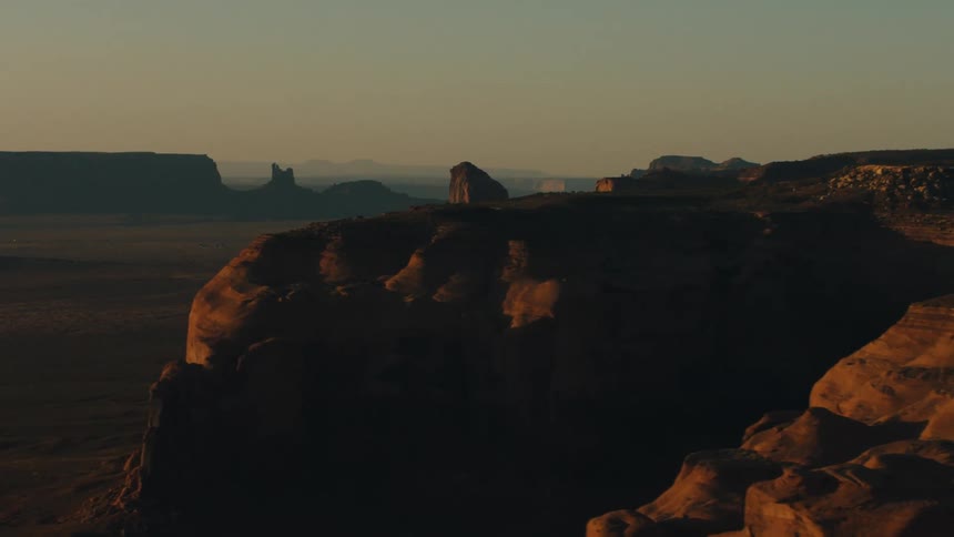 Aerial view of mesas on the badlands desert at sunset