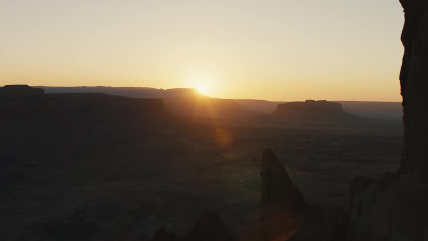 Sun rises over vast desert landscape