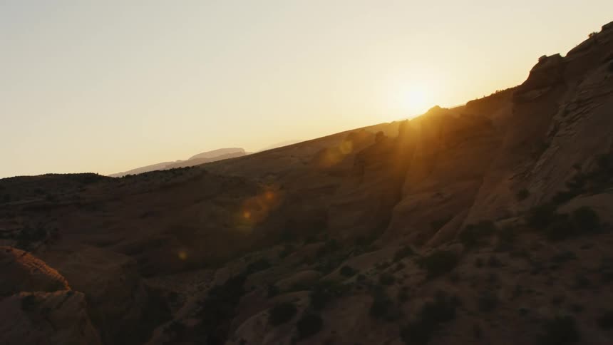 The sun over canyons in the badlands