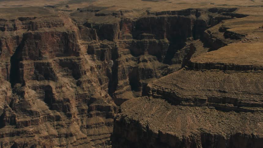 Cliffs in a canyon lead to a deep drop