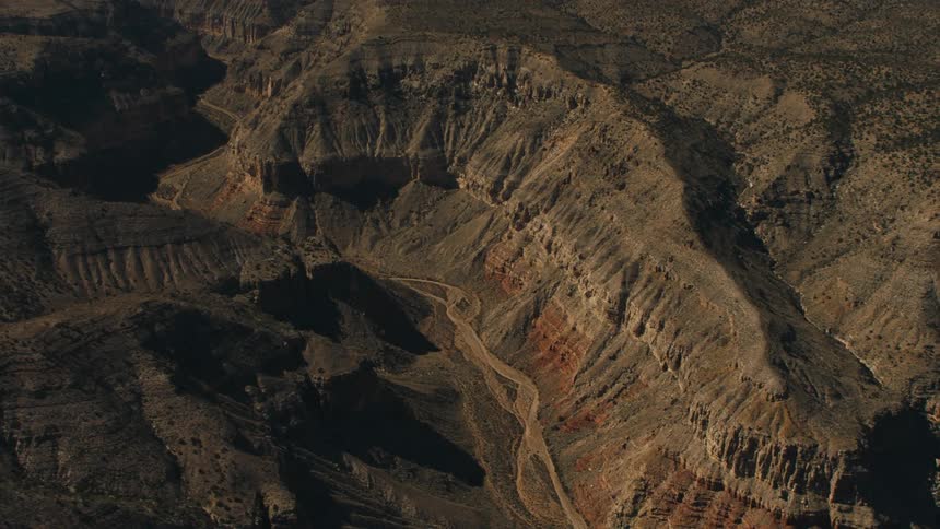 An aerial view of canyons is displayed