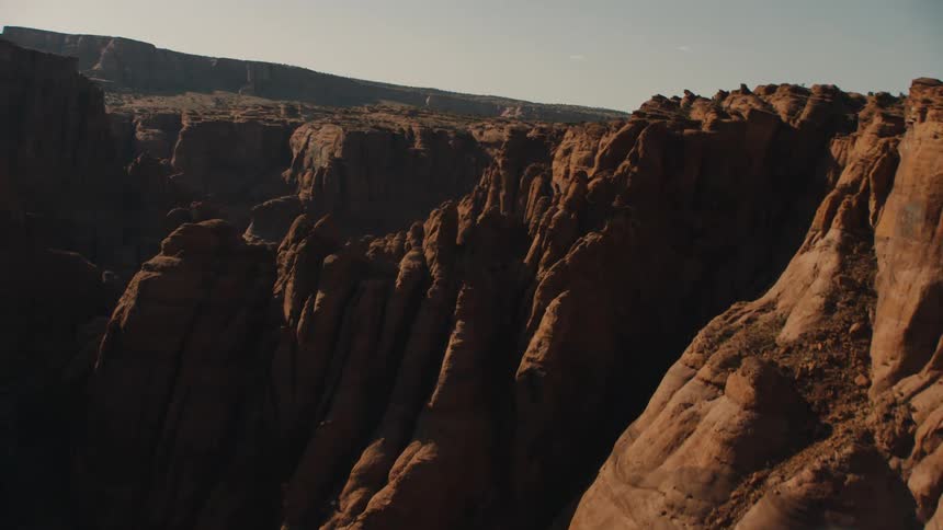 Aerial view of an eroded canyon between mesas in the badlands desert