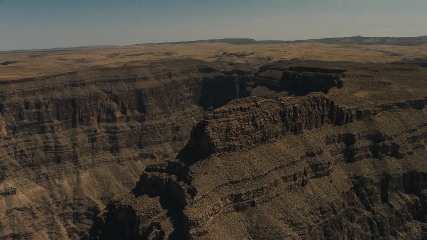 An aerial view of a mountain is displayed