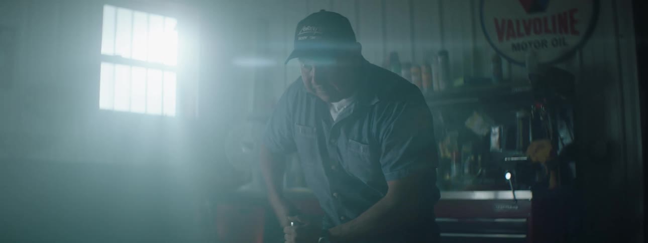 A mechanic is working on a car