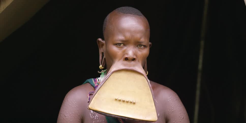 Close up of a woman with a very large lip plate