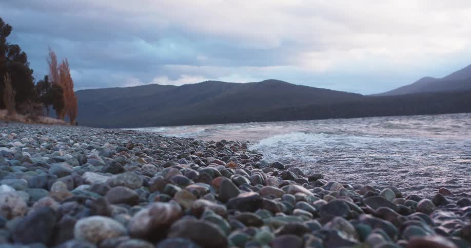 Water rolls into a rocky beach