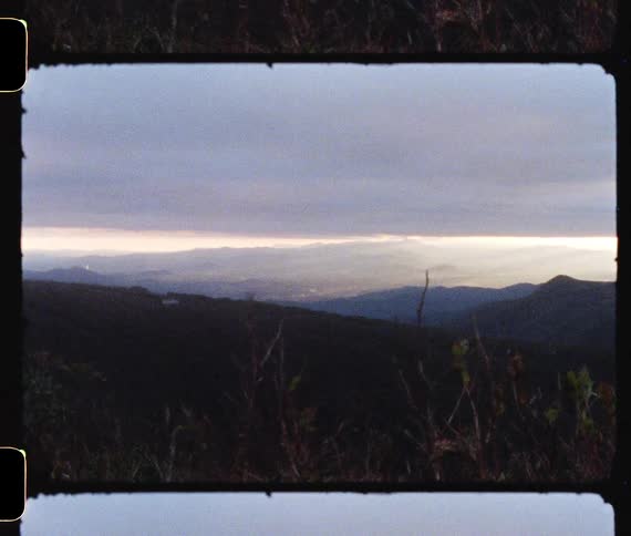 A hilly countryside on a cloudy day