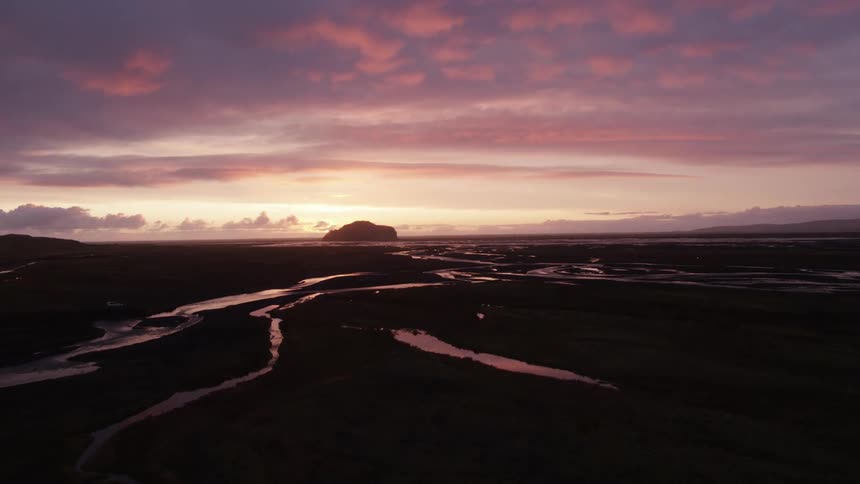 The sun is nearly set in the distance