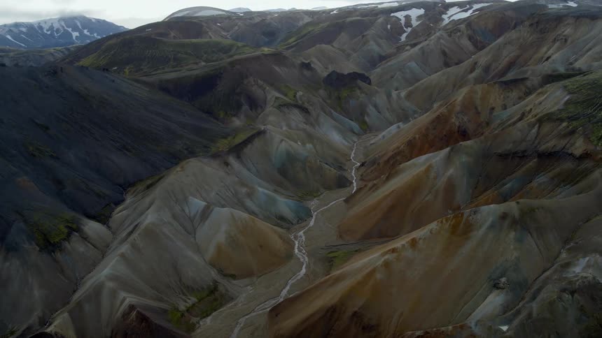 River winds through mountainous terrain