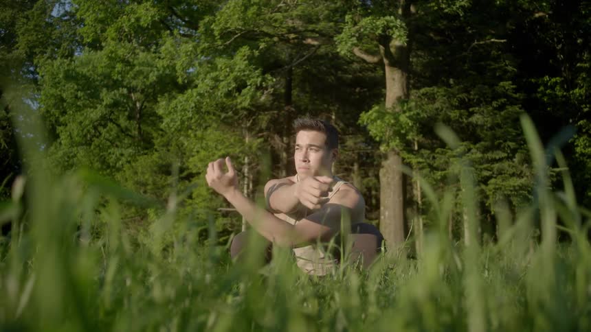A man is stretching outdoors