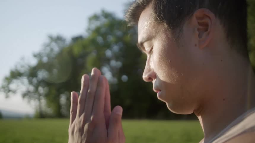 A man is stretching outdoors