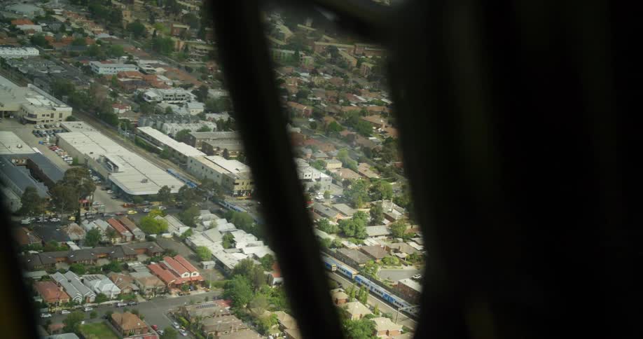 Aerial view of buildings and a train in a city