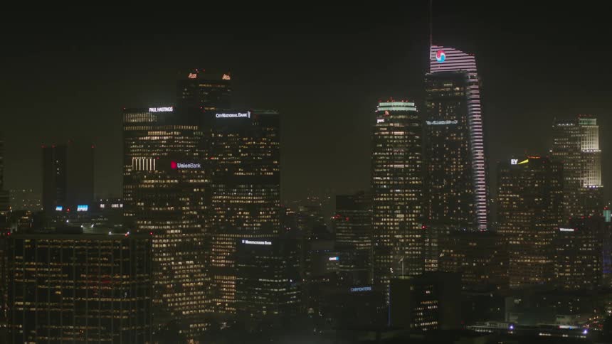A city skyline shines and glows at night