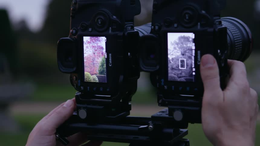 A person is taking pictures while using a camera
