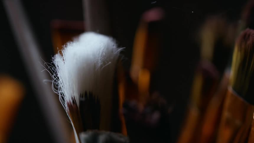 A bunch of artists paint brushes grouped together