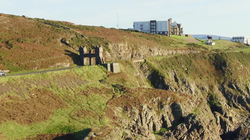 Gate tower stands near cliff side on mountain