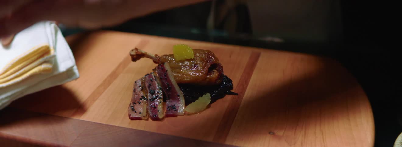 Chef preparing and serving an exotic dish