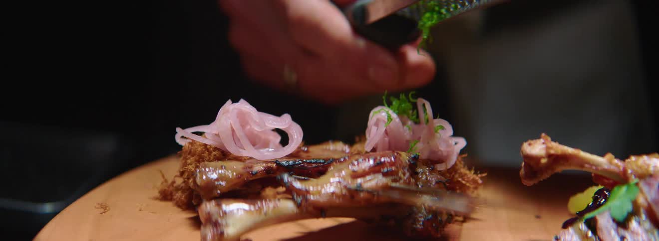 A chef is preparing a dish in the kitchen