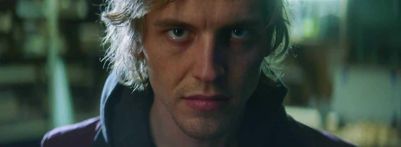 A young white man in a hoodie glaring at the camera
