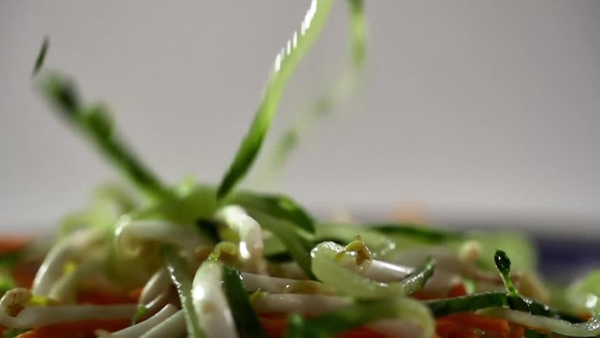 Sprouts falling onto vegetables