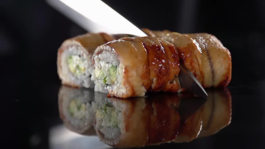 Silver knife slices through two food items