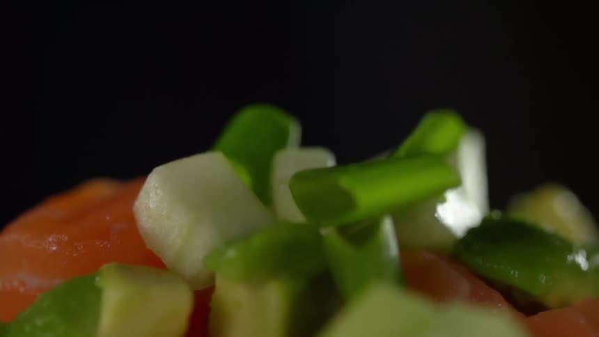 Garnish is dropped on the dish