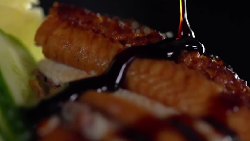 Sauce being drizzled on food for a photo shoot