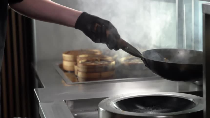 A person cooking in a restaurant