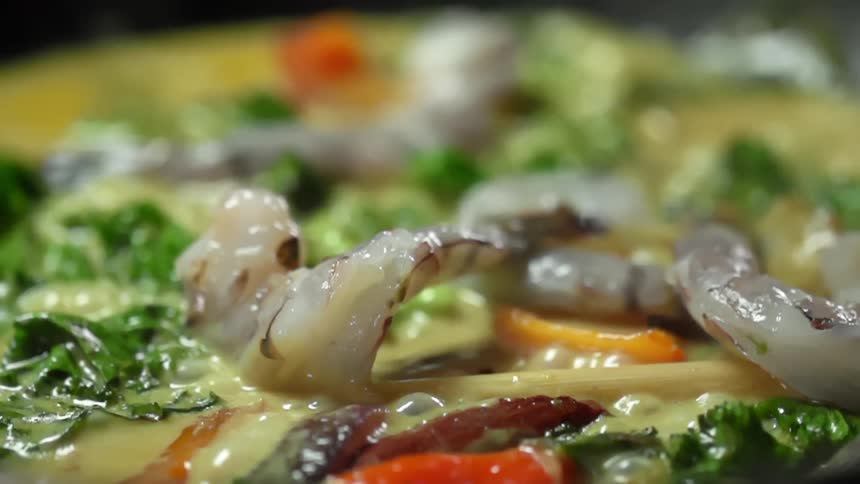 Curry being cooked and bubbling