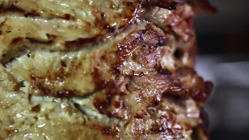 Close up of beef cooked well done as its rotating