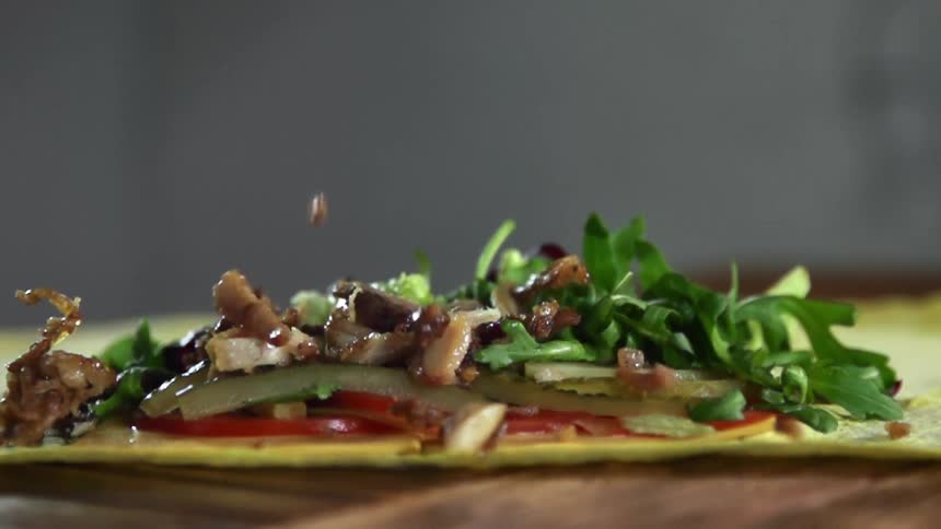 Food being put on a tortilla