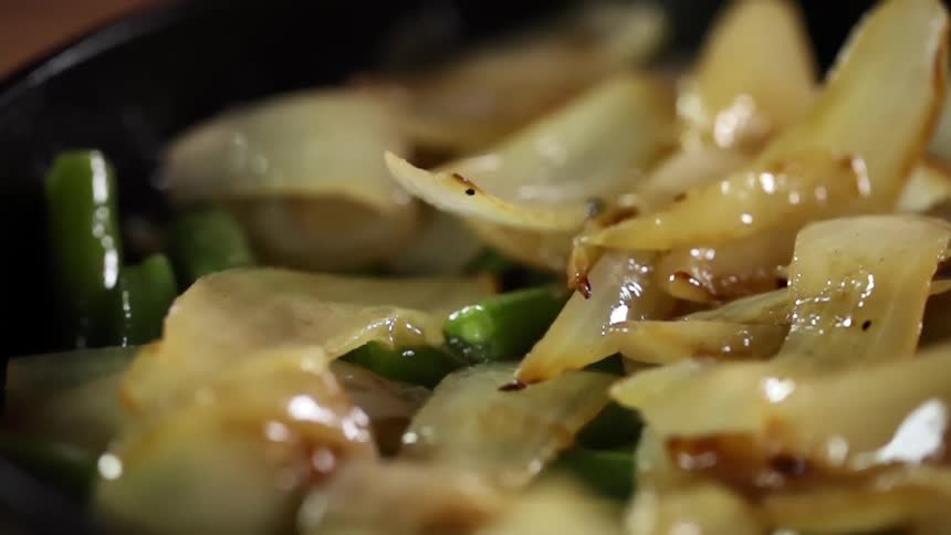 Onions are dropped on the stir fry