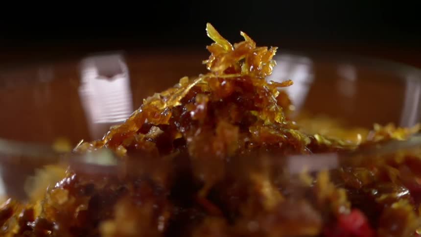Flavoured tobacco being poured into a bow