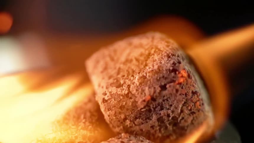 Charcoals are burned with a blowtorch