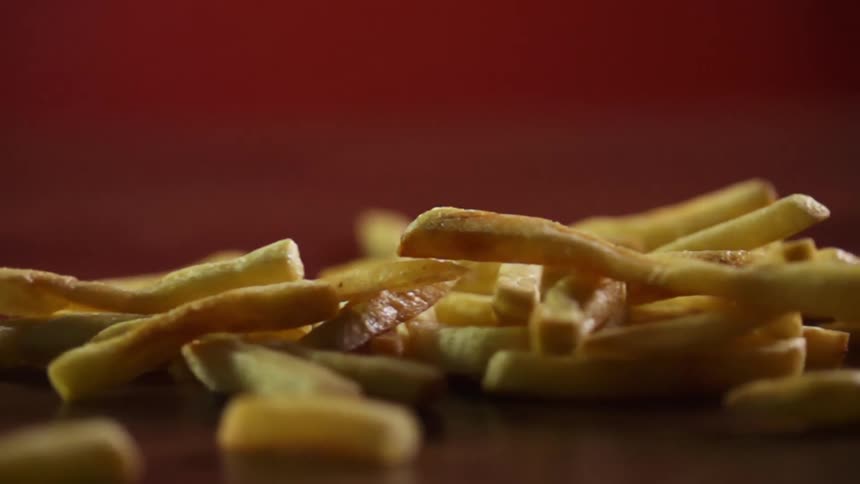 French fries falling on to a table