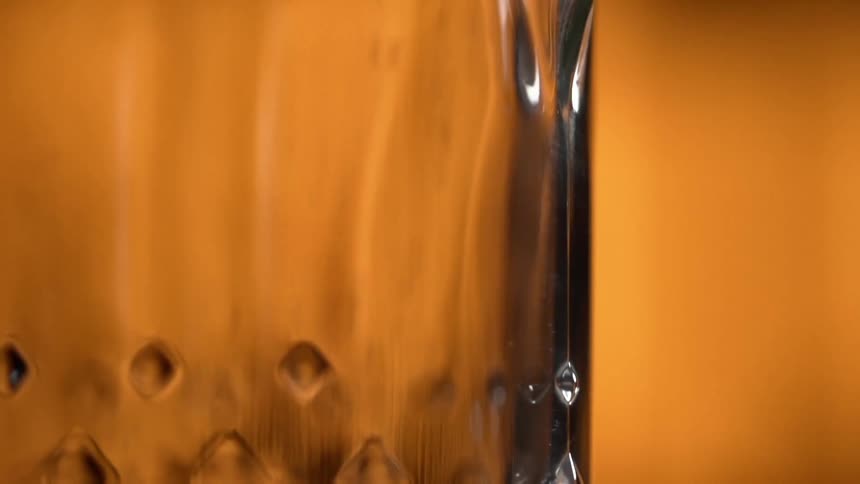 Spices are being sprinkled over the pitcher