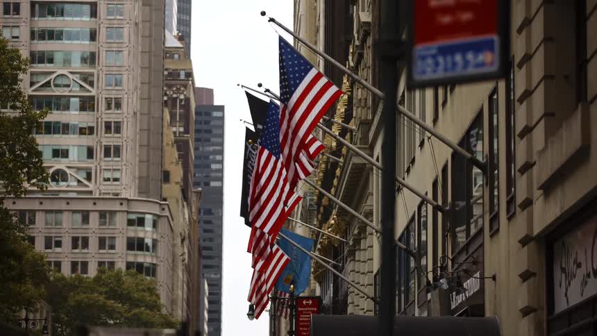 The wind blows the flags on the building