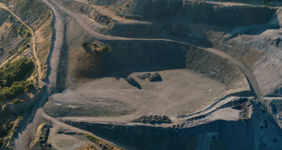 Aerial view of a open pit mine on the slopes of a mountain