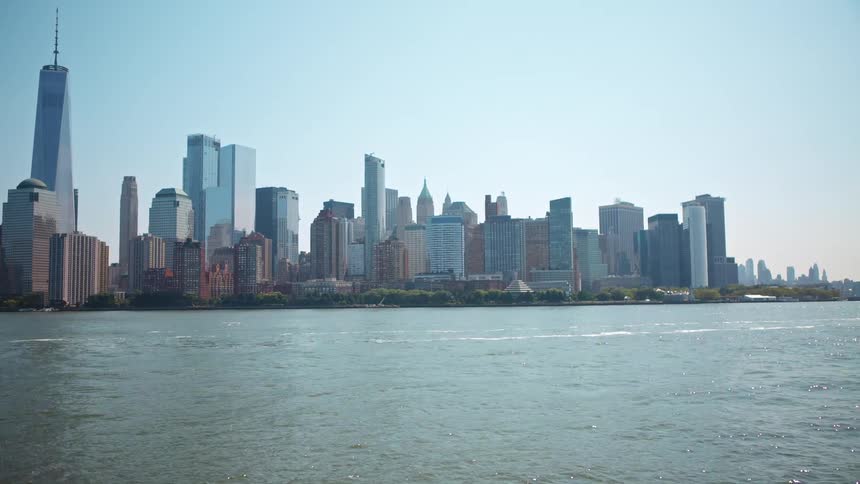 Water flows in the river next to the city